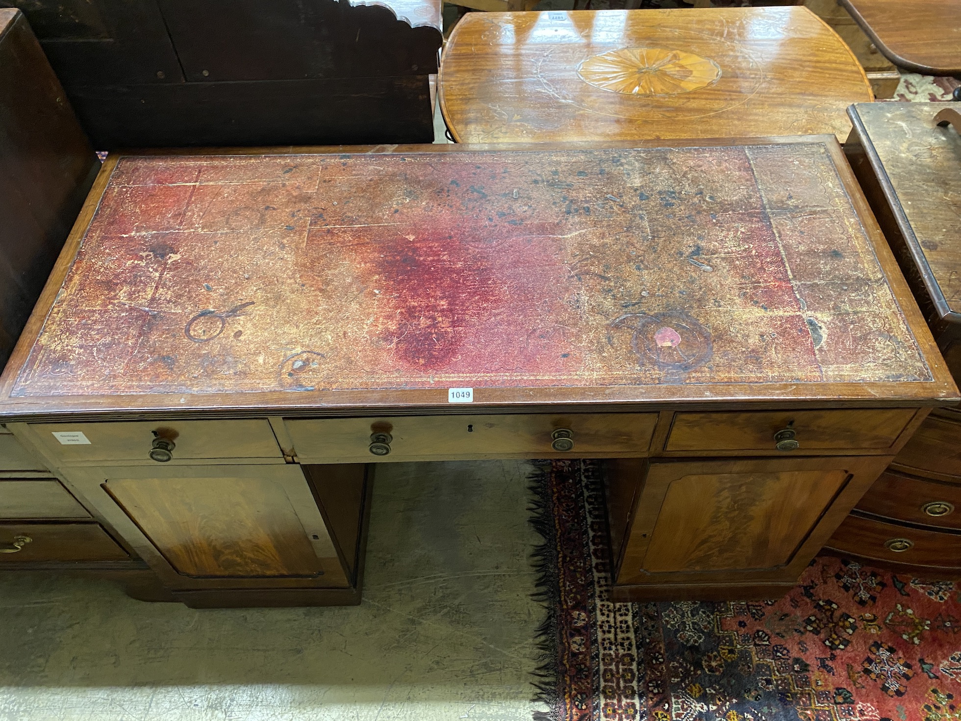 A Victorian mahogany kneehole desk, width 124cm, depth 54cm, height 76cm